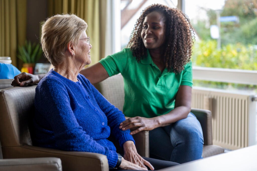 Helper caring for elderly lady